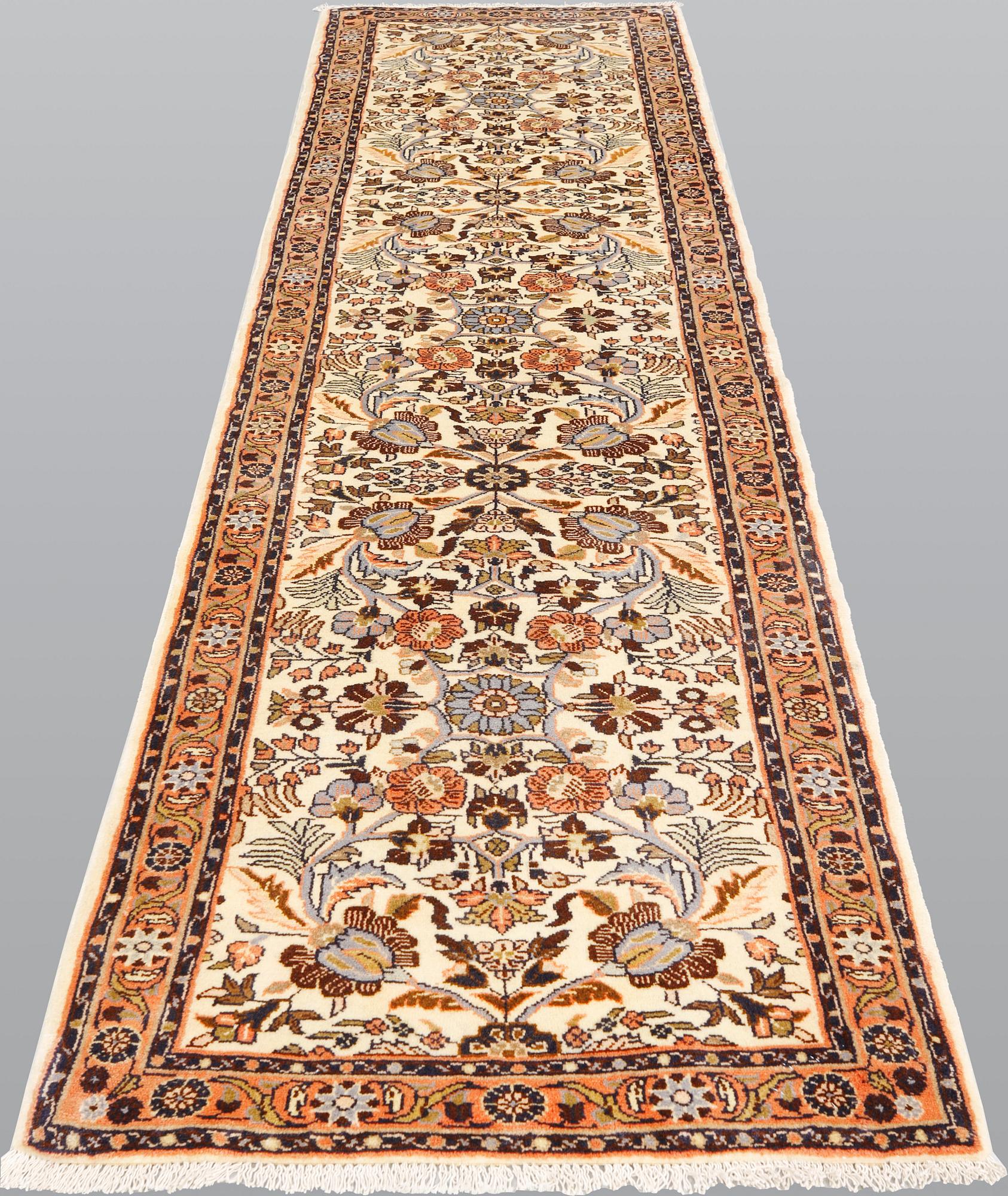 A Hamadan runner, ca 300 x 77 cm.