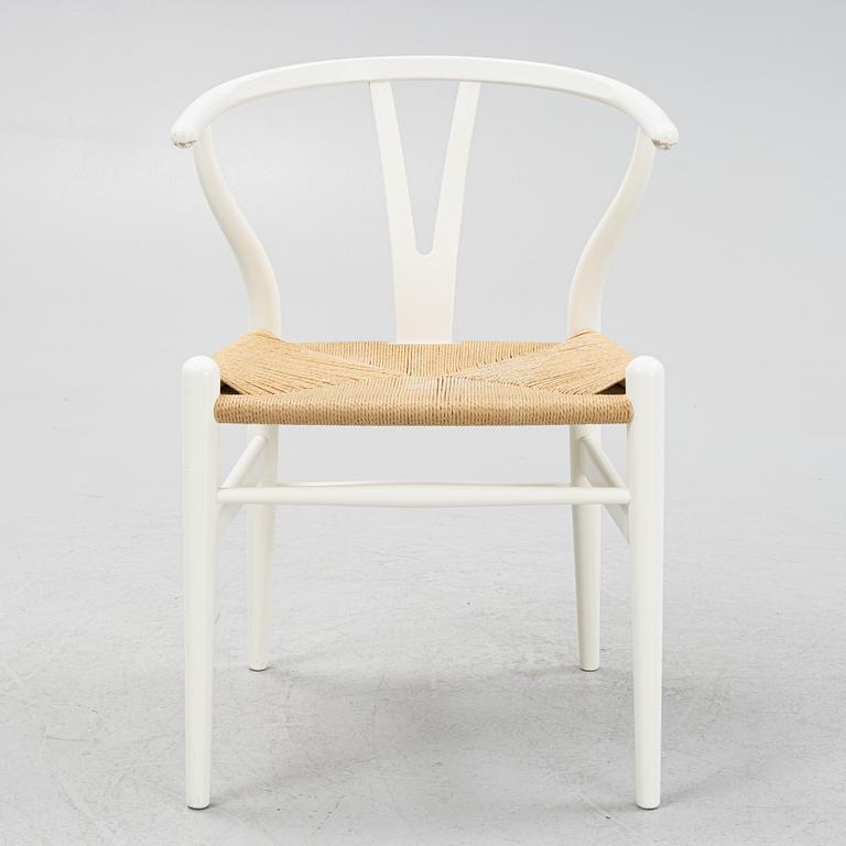 Hans J. Wegner, a model CH-24 chairs, Carl Hansen & Søn, Denmark.