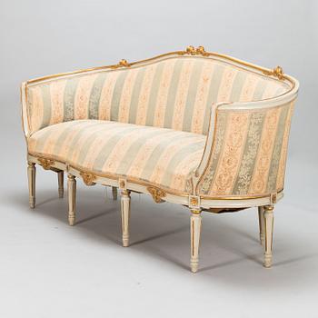 A Gustavian style sofa and table from early 20th century.