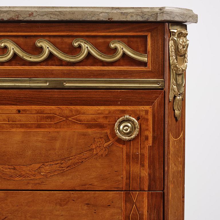 A Gustavian marquetry, ormolu-mounted and limestone-top commode by Georg Haupt (master in Stockholm 1770-84).