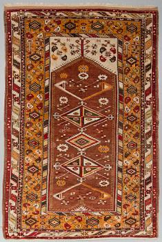 A CARPET, a semi-antique Melas/Milas, Anatolia, ca 257 x 174 cm (as well as 3 and 1 cm flat weave at the ends).
