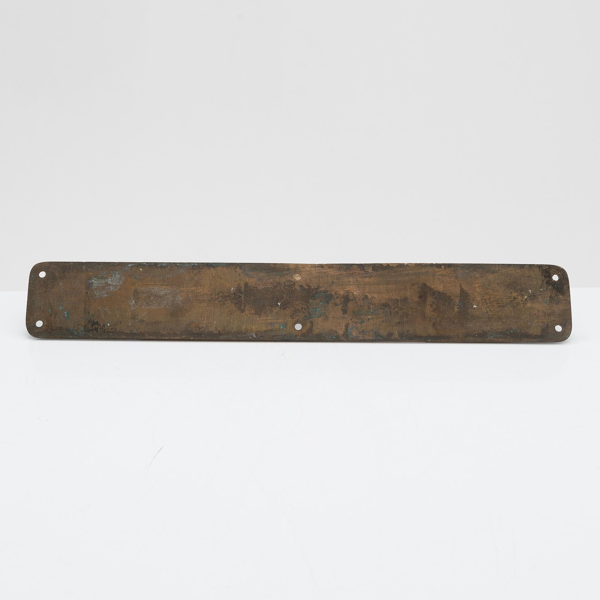 An Art Nouveau door handle from early 20th century.