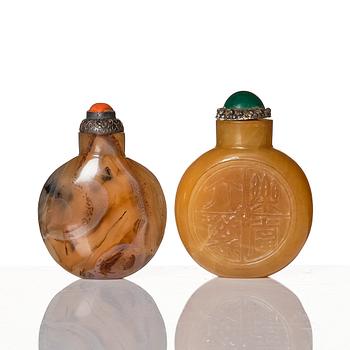 A set of four Chinese snuff bottles and a sculpture, 20th Century.