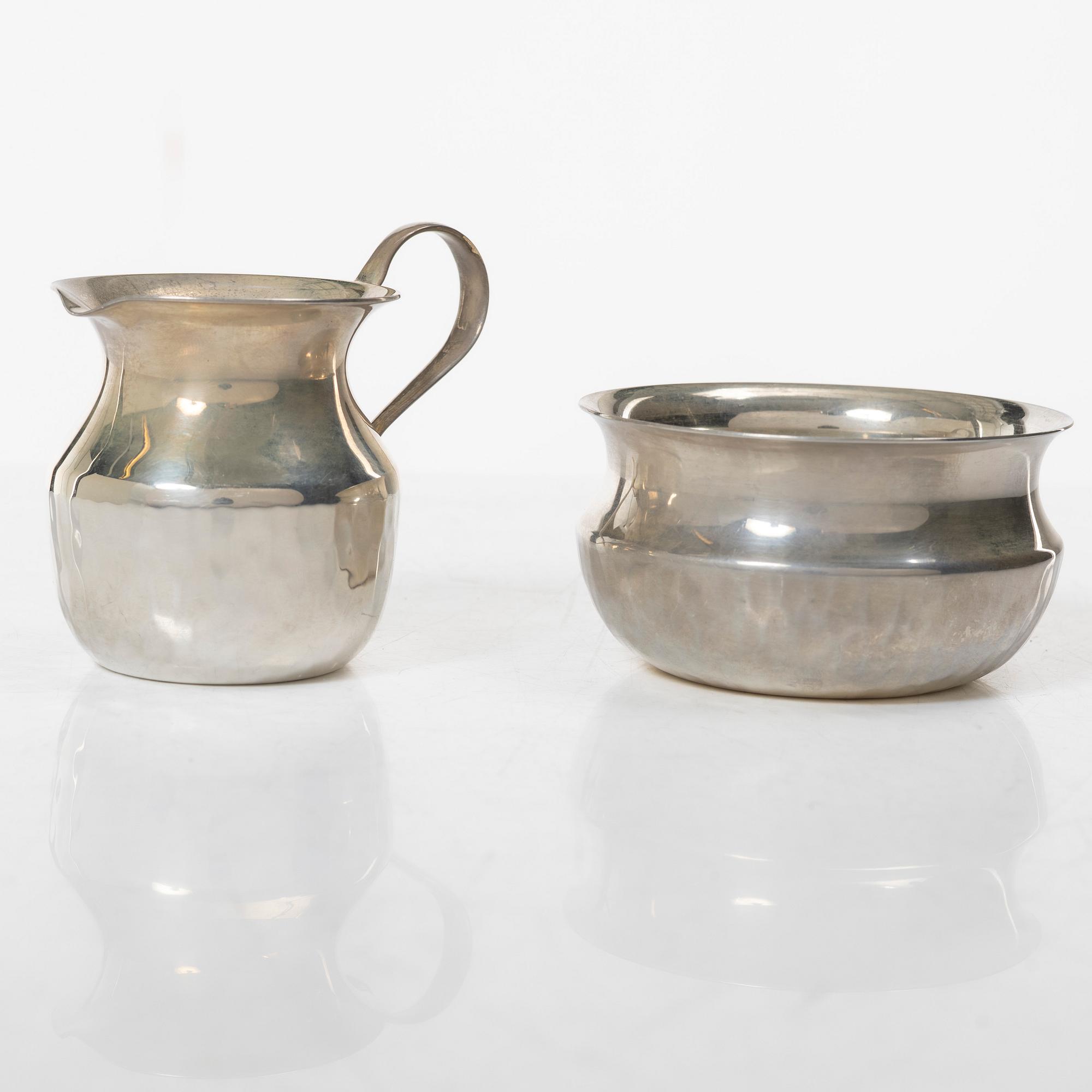 a silver creamer and sugar bowl, designed by Christian, Gewe Silvervarufabriken Ab, Malmö, Sweden, 1974-75.