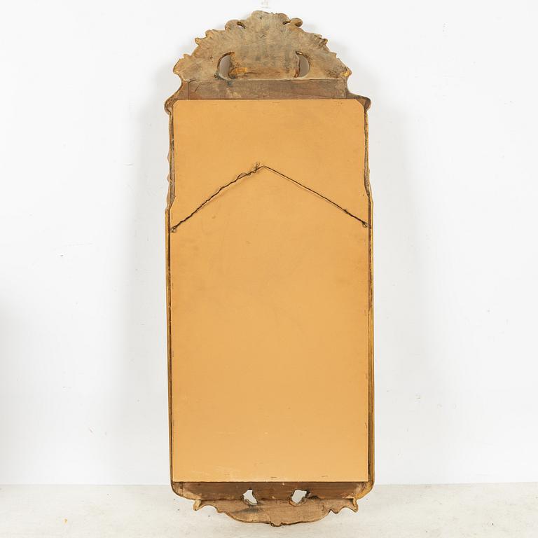 A Rococo style mirror, first half of the 20th Century.