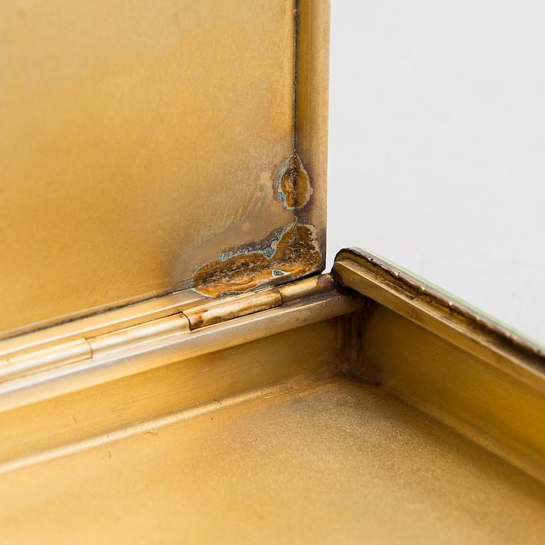 A gilded silver cigarette case with enamel and rose-cut diamonds. Moscow, early 20th century.