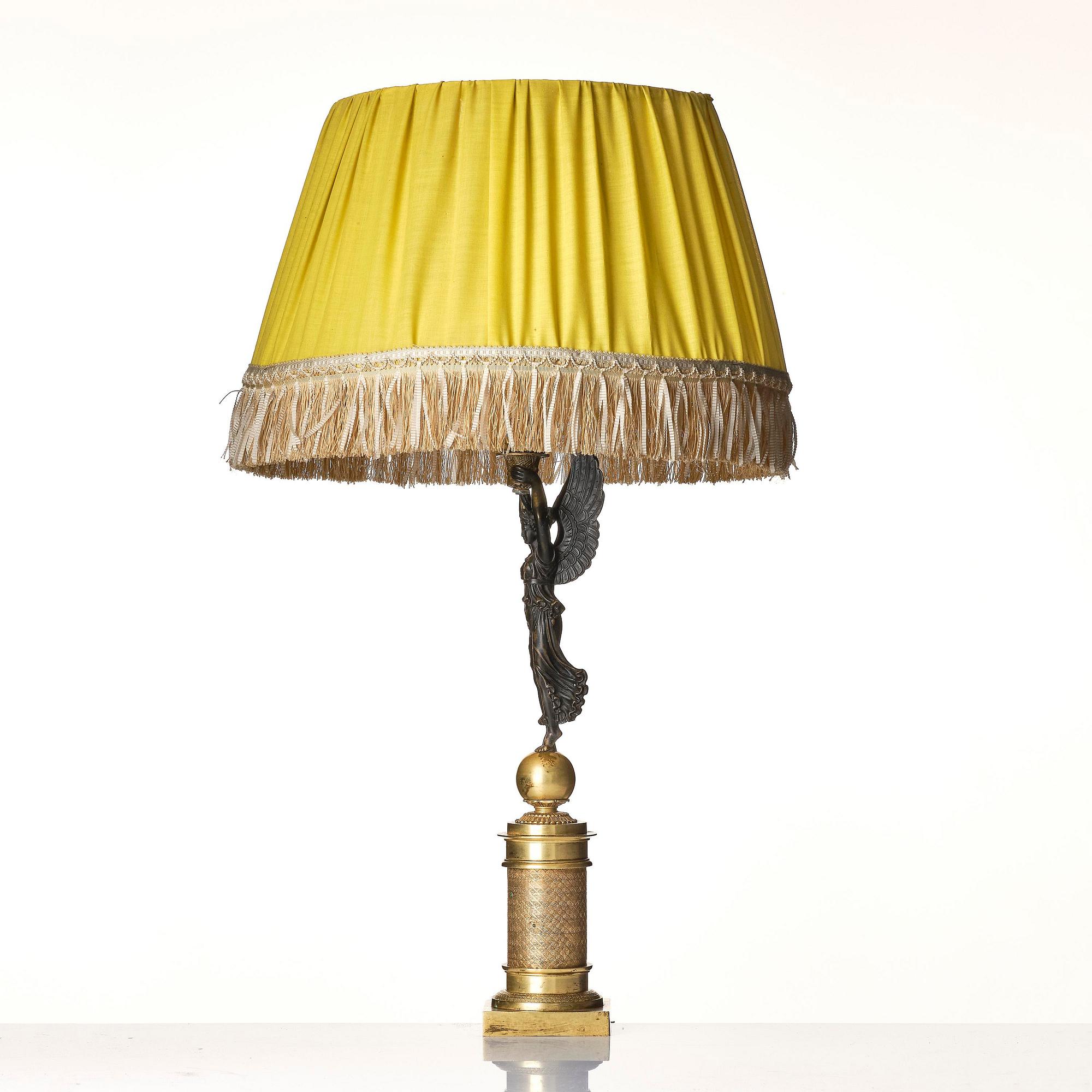 A French Empire ormolu and patinated bronze table lamp, early 19th century.
