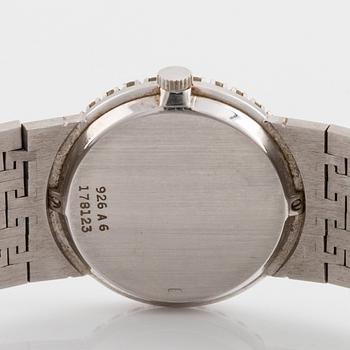 A Piaget 18K white gold wrist watch set with round brilliant-cut diamonds.