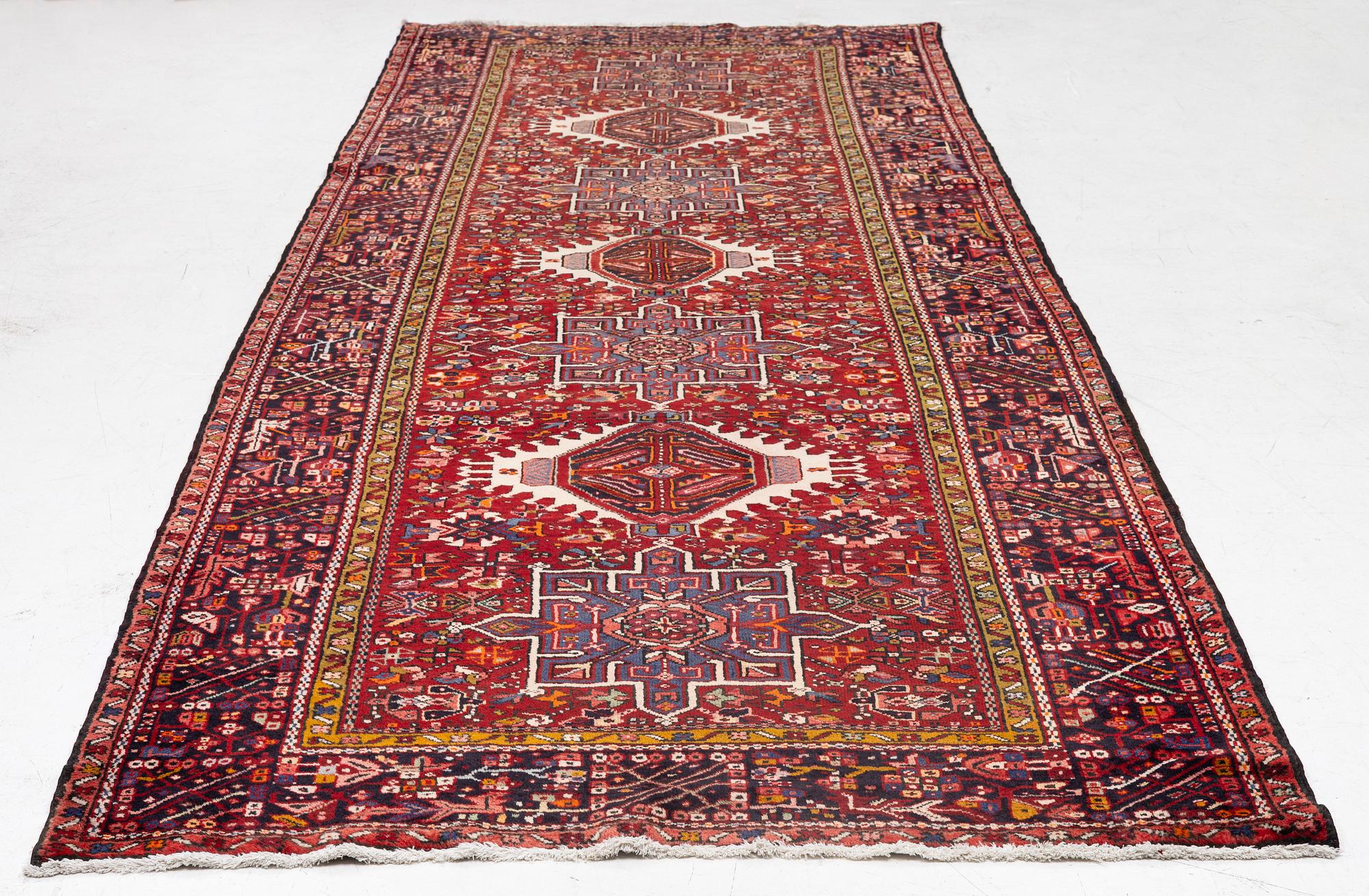 A semi-antique Karadja runner, c. 405 x 155 cm.