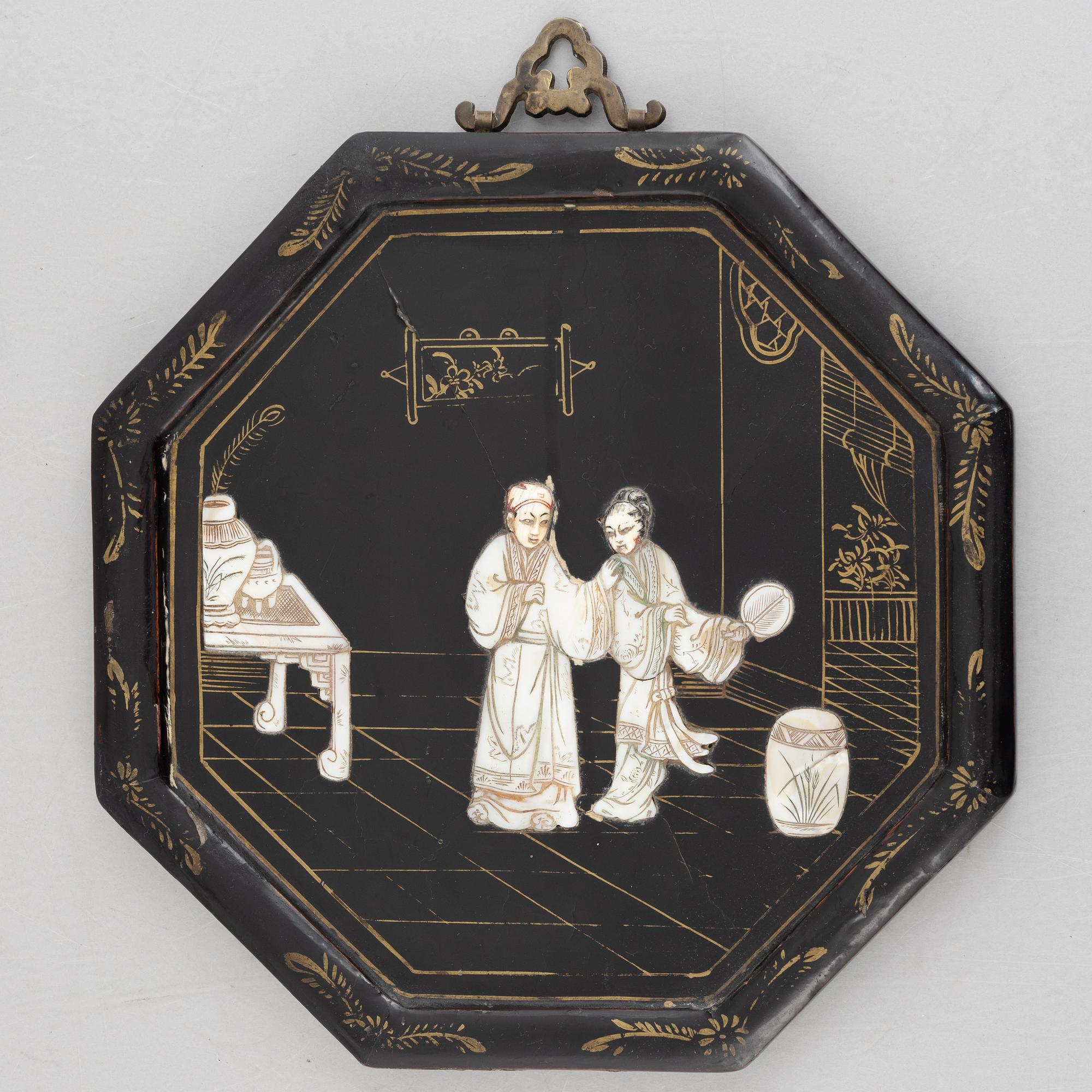 Four black-lacquered wall decorations, China, around 1900.