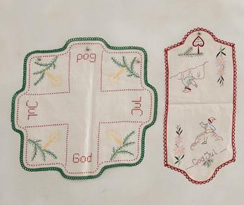A collection of smaller Christmas tablecloths, runners, and wall hangings, approximately 34 pieces, mid/second half of the 20th century.