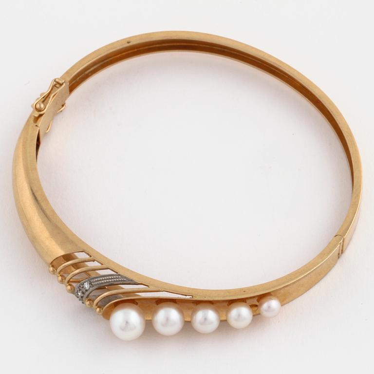 A cultured pearl and single cut diamond bangle by Svedboms, Vetlanda, 1968.