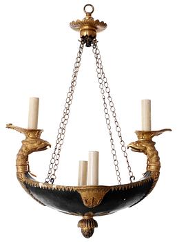 An Empire wooden four-light hanging lamp.