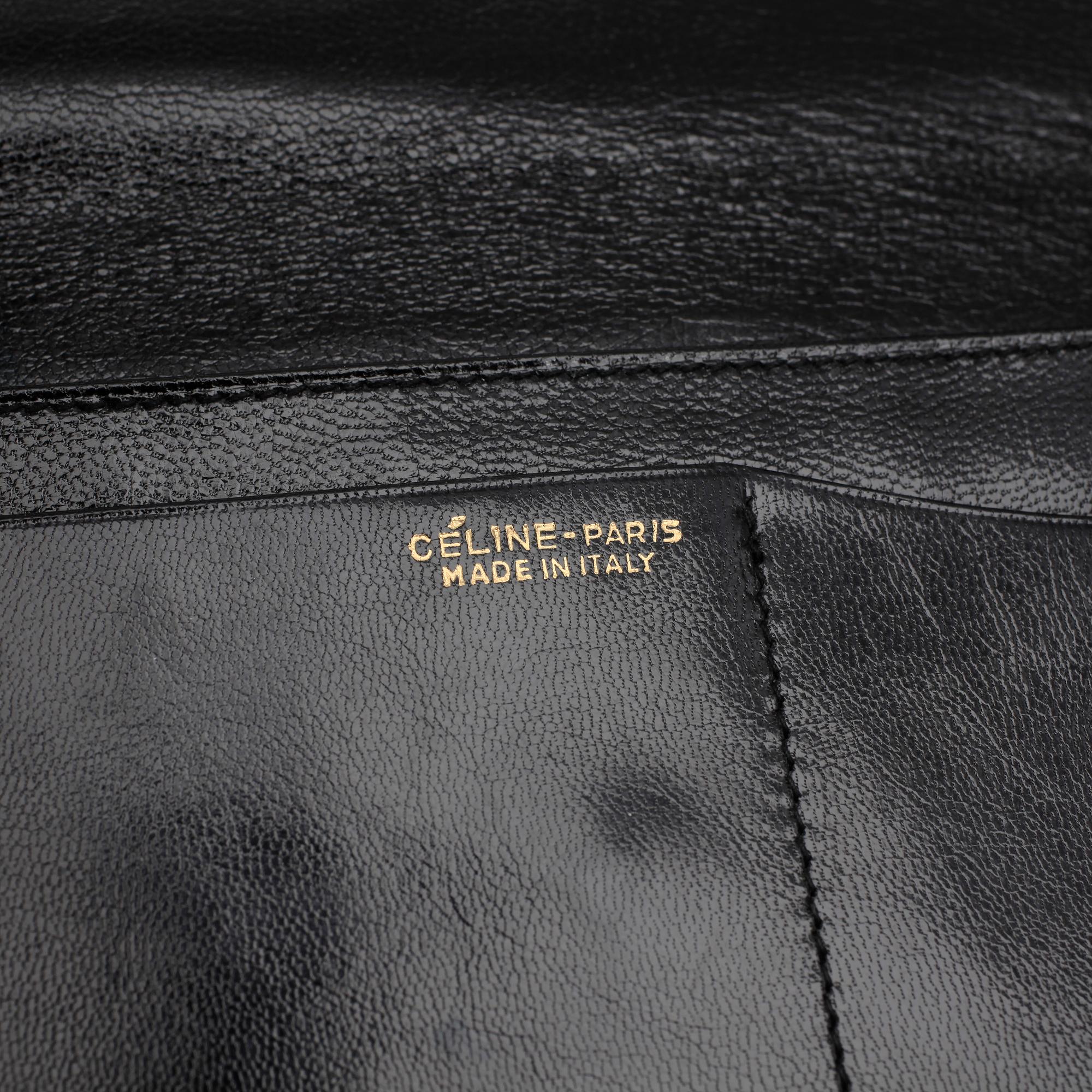 CÉLINE, a black leather evening bag.