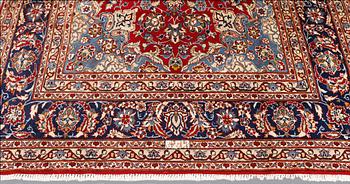 A signed Kashan carpet, ca 313 x 195 cm.
