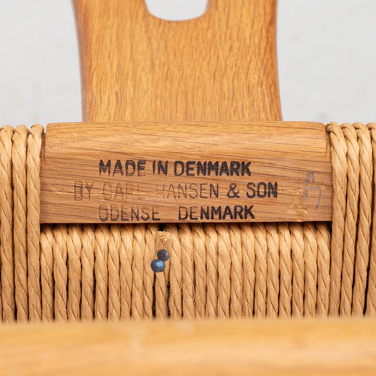 Hans J. Wegner, four model CH-24/ 'Wishbone' chairs, Carl Hansen, Odense, Denmark, second half of the 20th century.