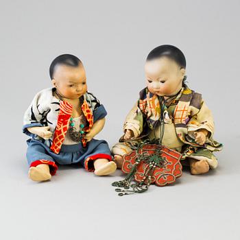 Two oriental bisque head baby dolls by Armand Marseille and Heubach Köppelsdorf, Germany, early 20th century.