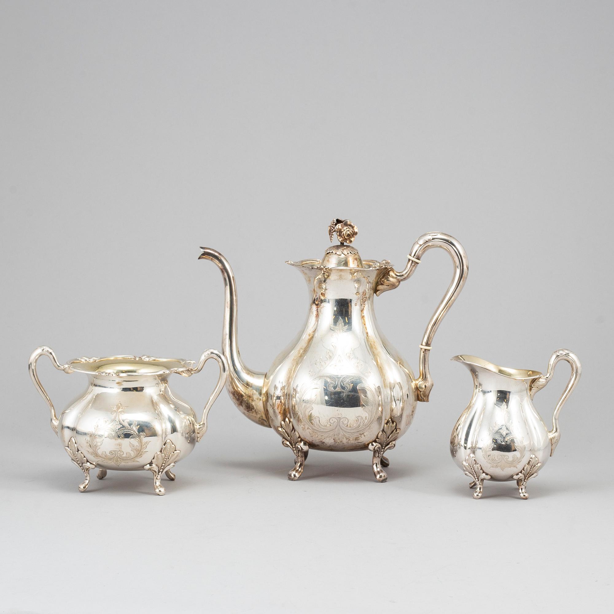 A silver coffee pot, creamer and sugar bowl. GAB, Stockholm 1945.