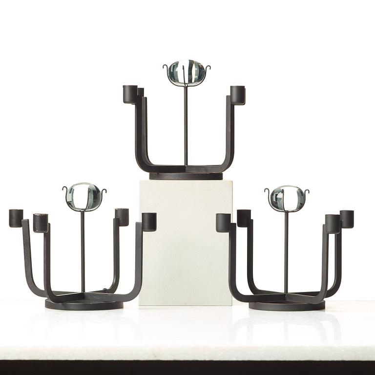 Gunnar Ander, a set of three iron and glass candlesticks for Ystad Metall, Sweden, mid 20th century.