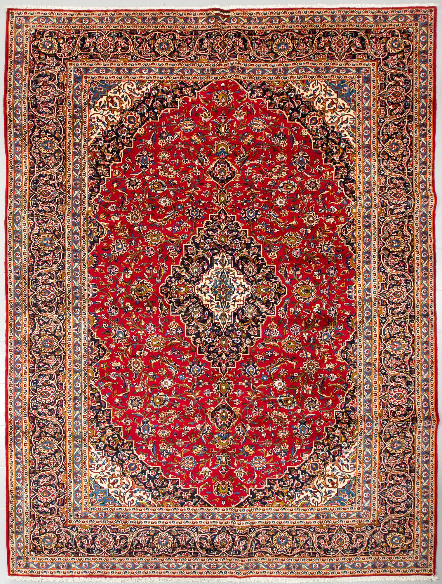 A Keshan rug, signed, 410 x 295 cm.