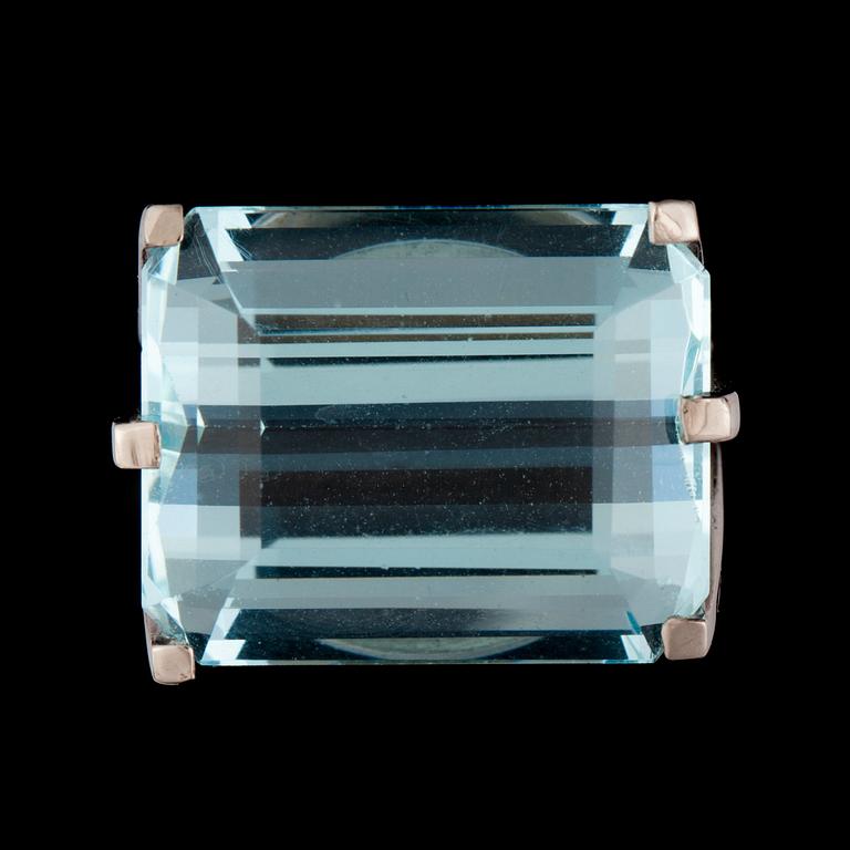 A step-cut aquamarine, 25.13 cts, ring.