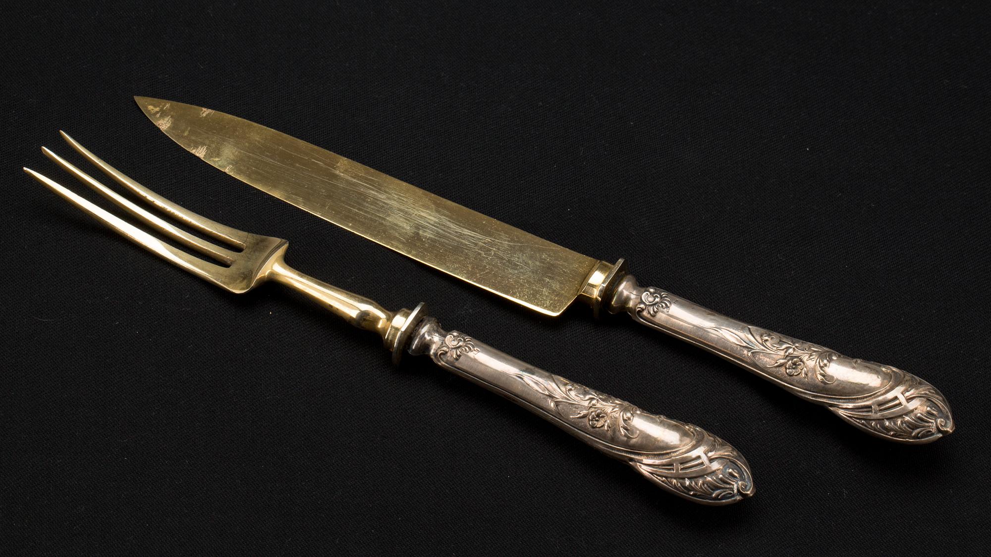 TRANCHERBESTICK, ett par, silver 800, Tyskland. Omkring 1900.