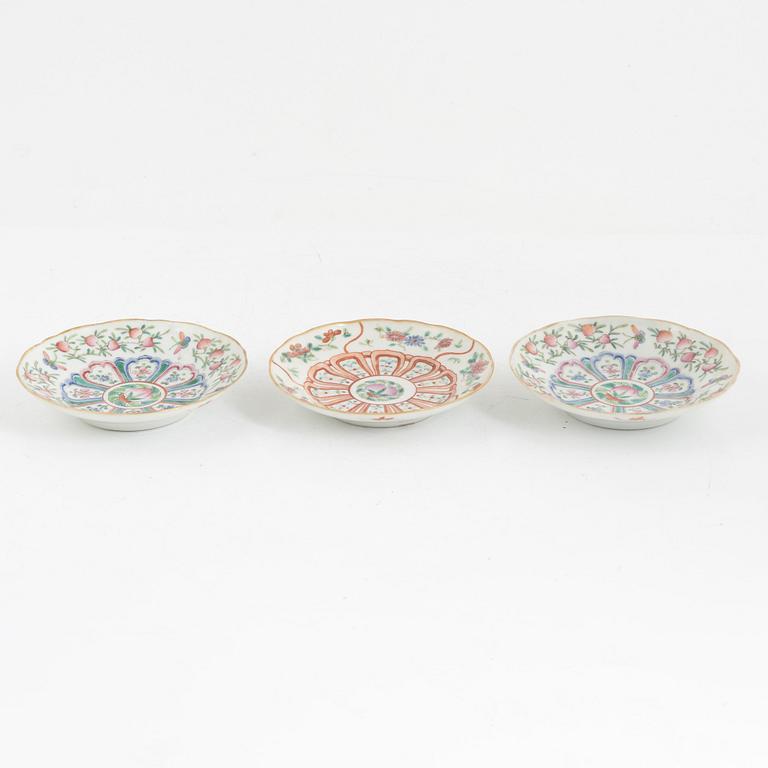 A pair of Chinese famille rose porcelain covers, and three saucers, late Qing dynasty, 19th century.