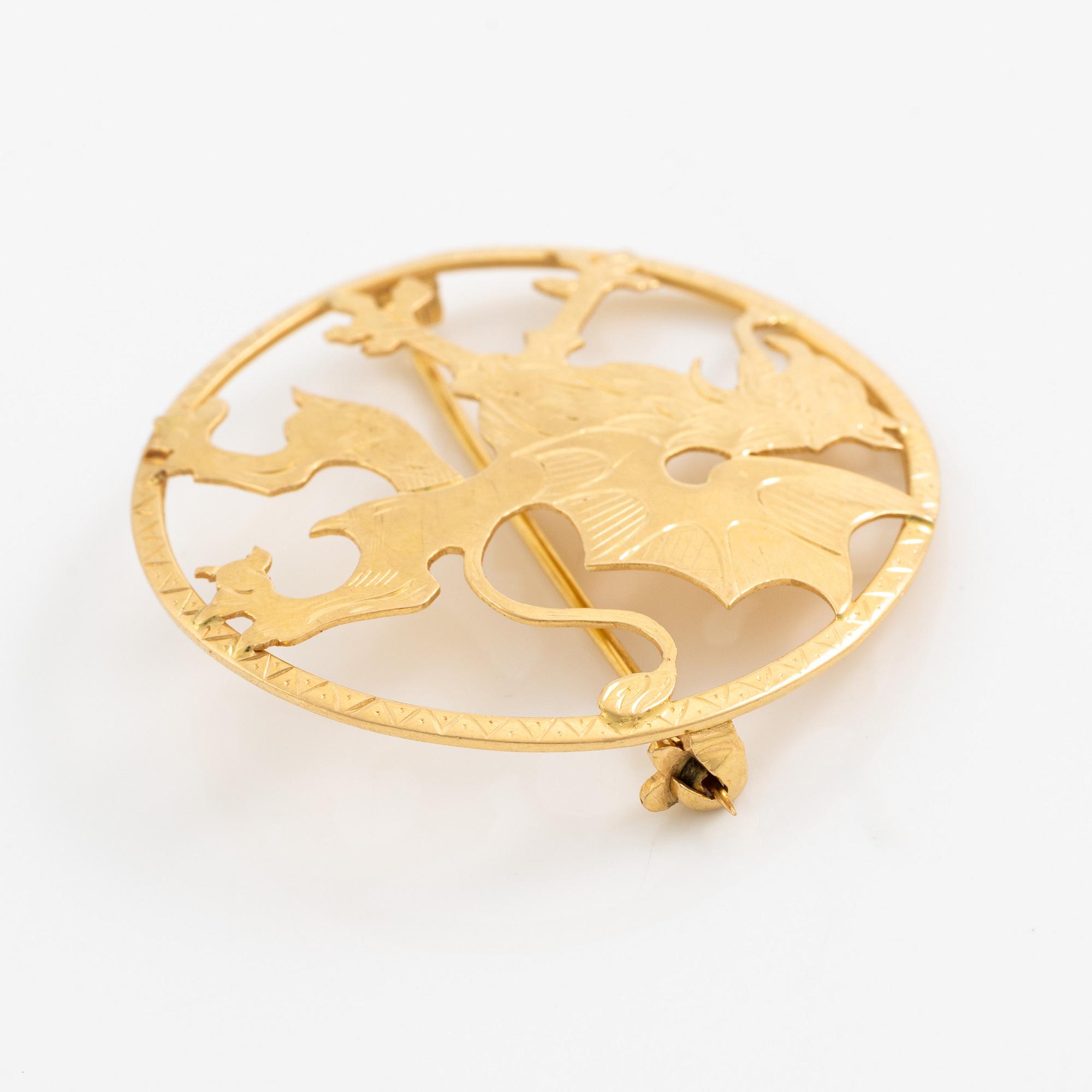 Brosch 18K guld.
