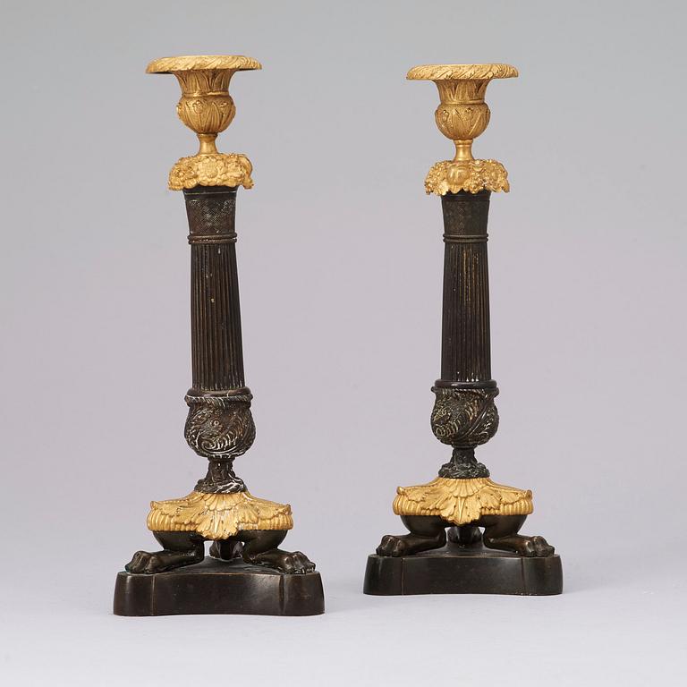 A pair of late Empire 19th century candlesticks.