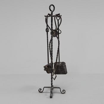 A set of wrought iron fire utensils.