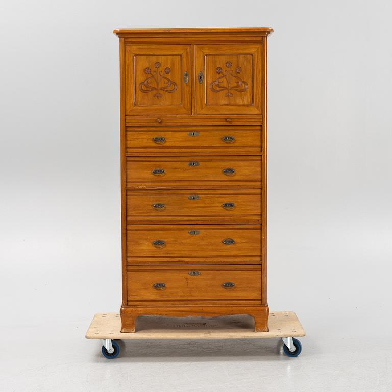 A walnut veneered tall boy dresser, early 20th century.