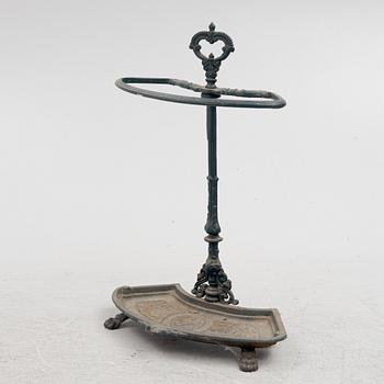 A cast-iron umbrella stand, circa 1900.