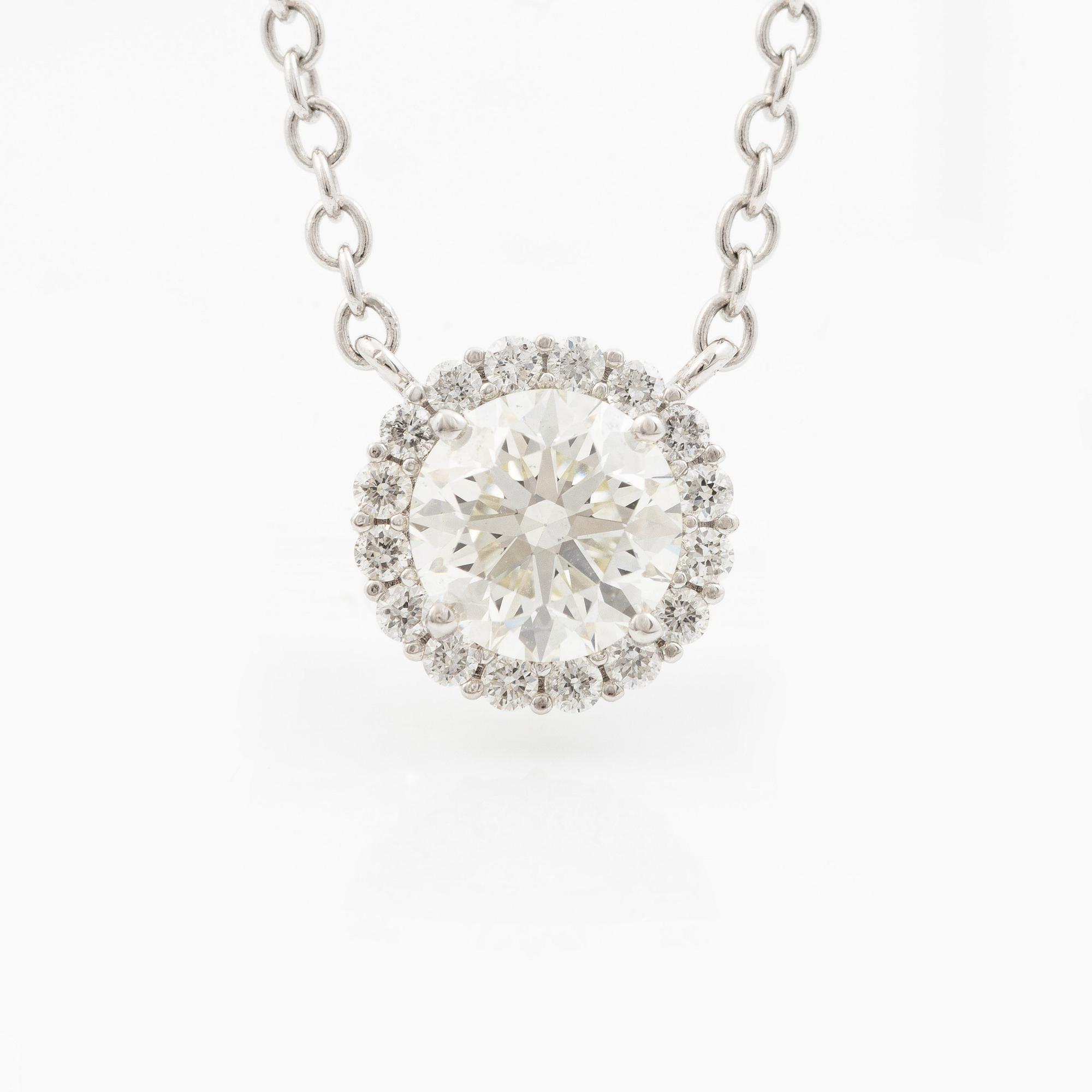 Collier 18K vitguld med briljantslipad diamant.