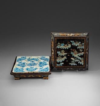 150. A black lacquer box and cover with a nine-piece cabaret, Qing dynasty, 19th Century.