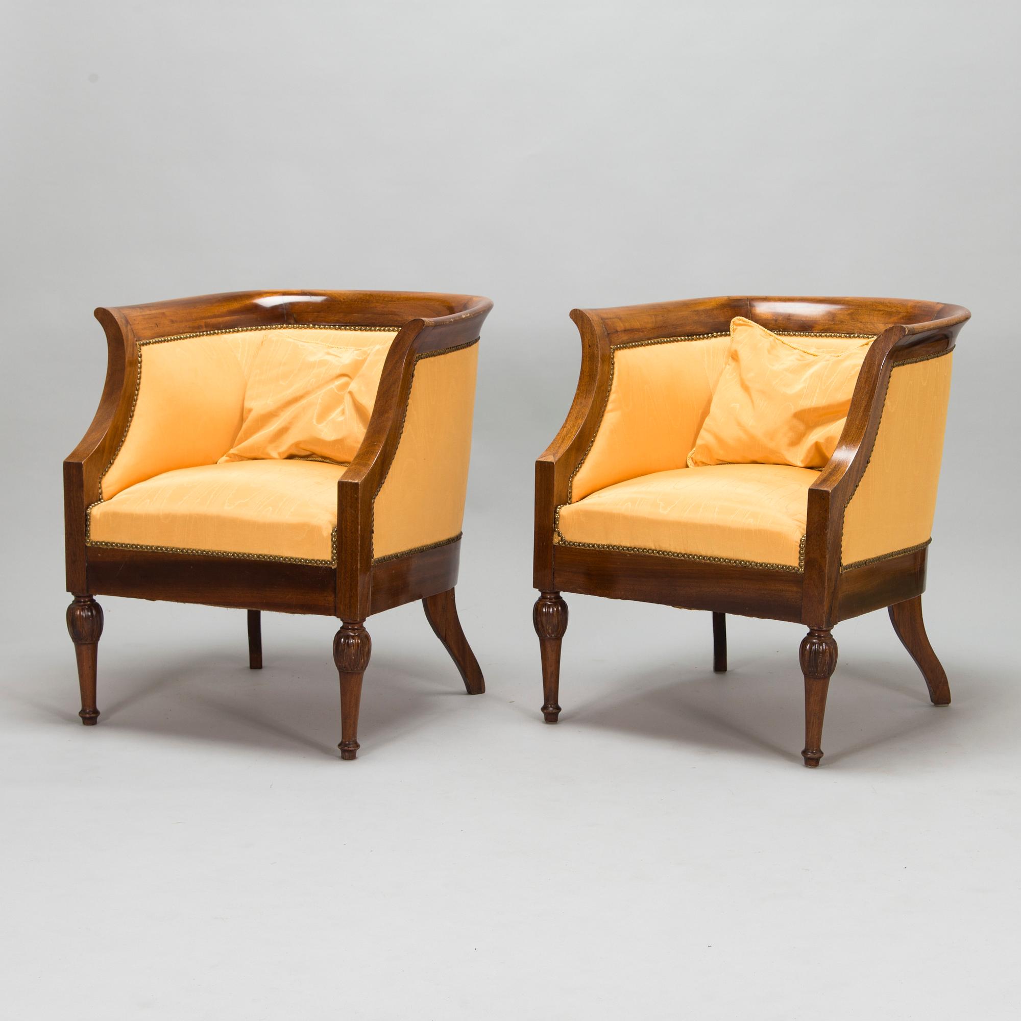 Pair of mahogany and mahogany veneered armchairs, 1920-30s.