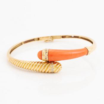 Gold and coral and diamond bangle.