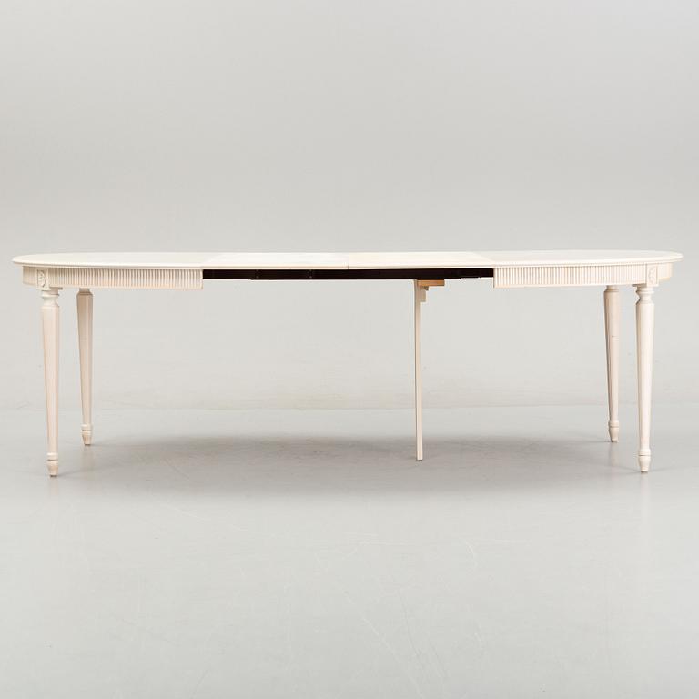 A dining table with eight chairs and a stool, Gustavian style, second half of the 20th Century.