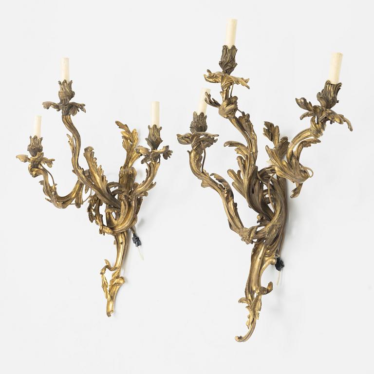 A pair of gilt-brass Louis XV-style wall-lights, circa 1900.