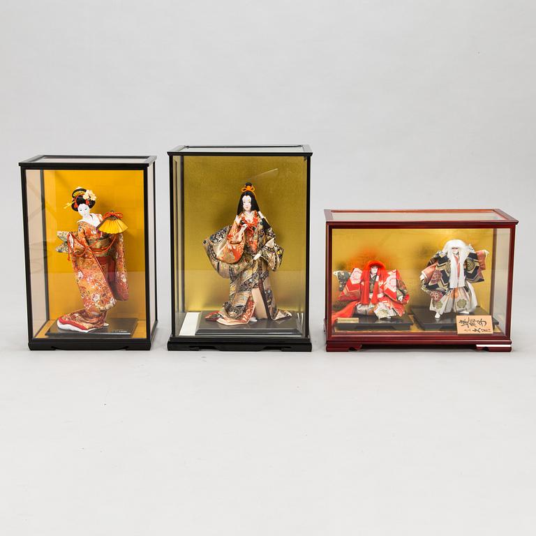 Four late 20th century Japanese dolls.