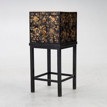 A lacquered end table/box with stand, Japan, 20th century.