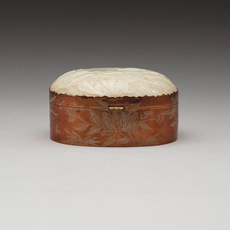 A metal box with cover with a large carved jade plaque, China early 20th Century.