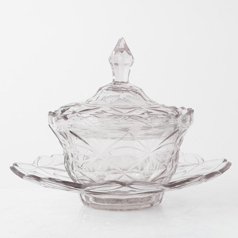 A pair of lidded glass bowls with stands, late 19th century.