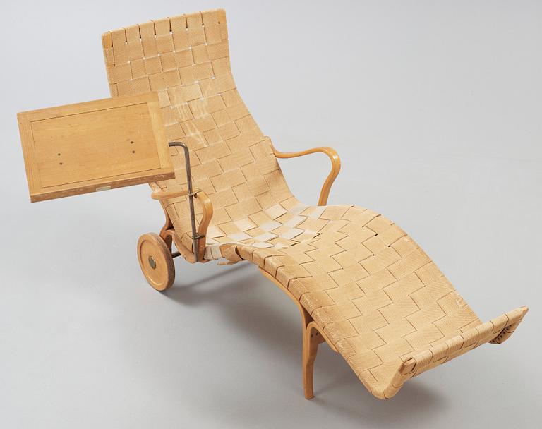 A Bruno Mathsson Swedish Modern chair with attached reading table, Karl Mathsson, Värnamo 1944.