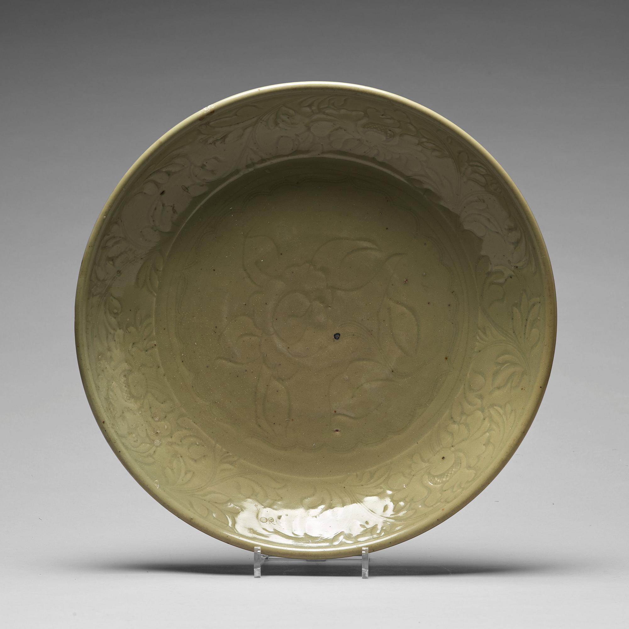 A large celadon glazed dish, Ming dynasty (1368-1644).