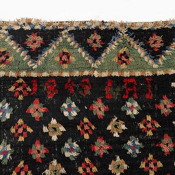 A Knotted pile (rya), c. 200 x 140 cm, Finland, dated 1849.
