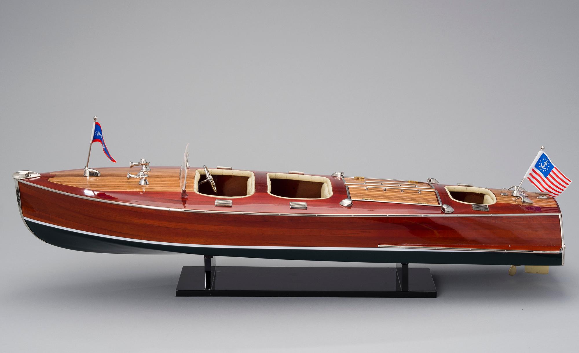 A "Chris-Craft triple cockpit" model boat, 21st century.