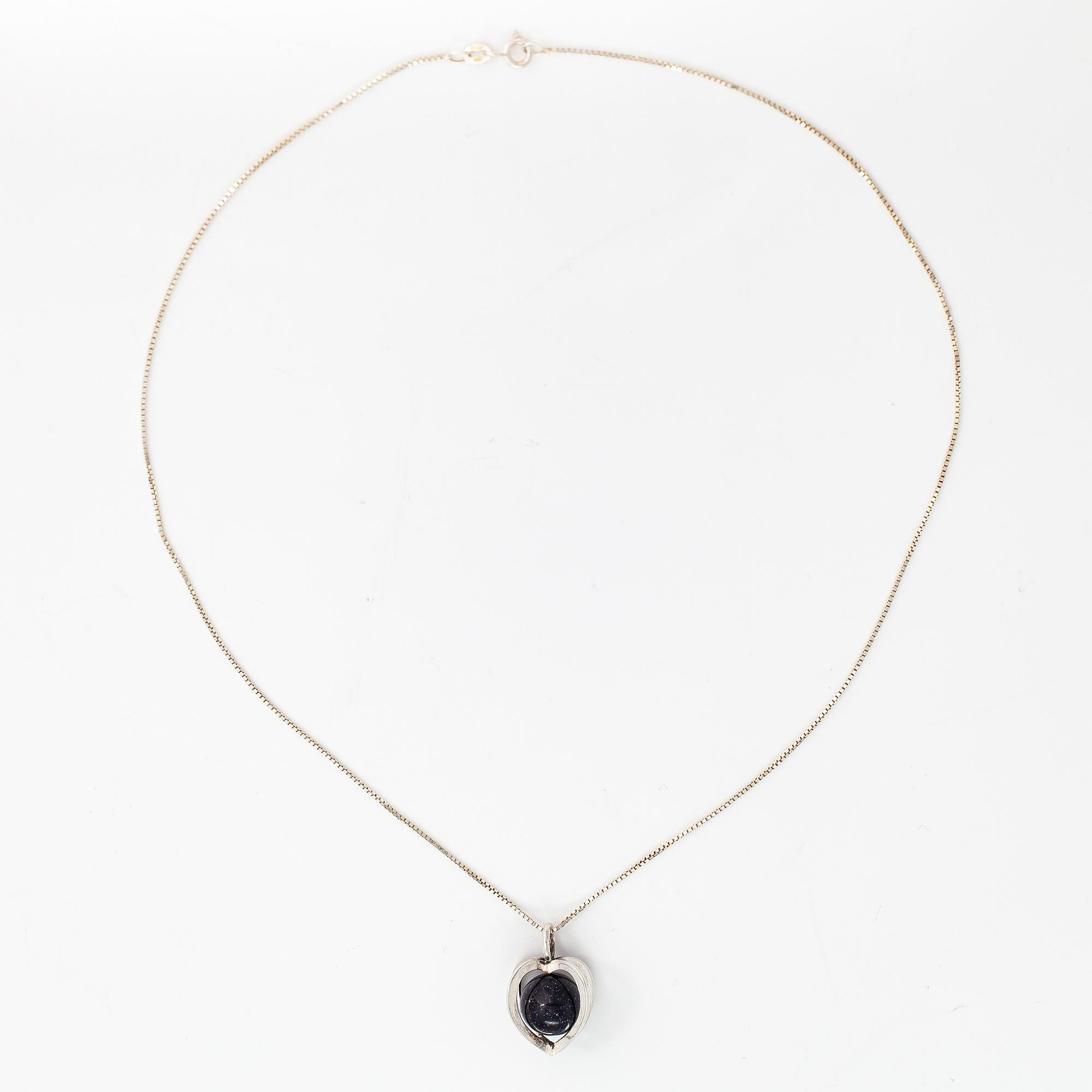 Elis Kauppi, A silver necklace with a purple goldstone. Kupittaan kulta, Turku.
