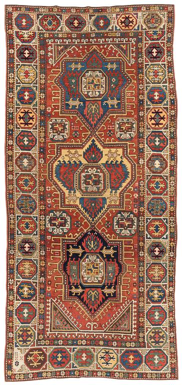 An antique Konya long rug, c. 324 x 144 cm.
