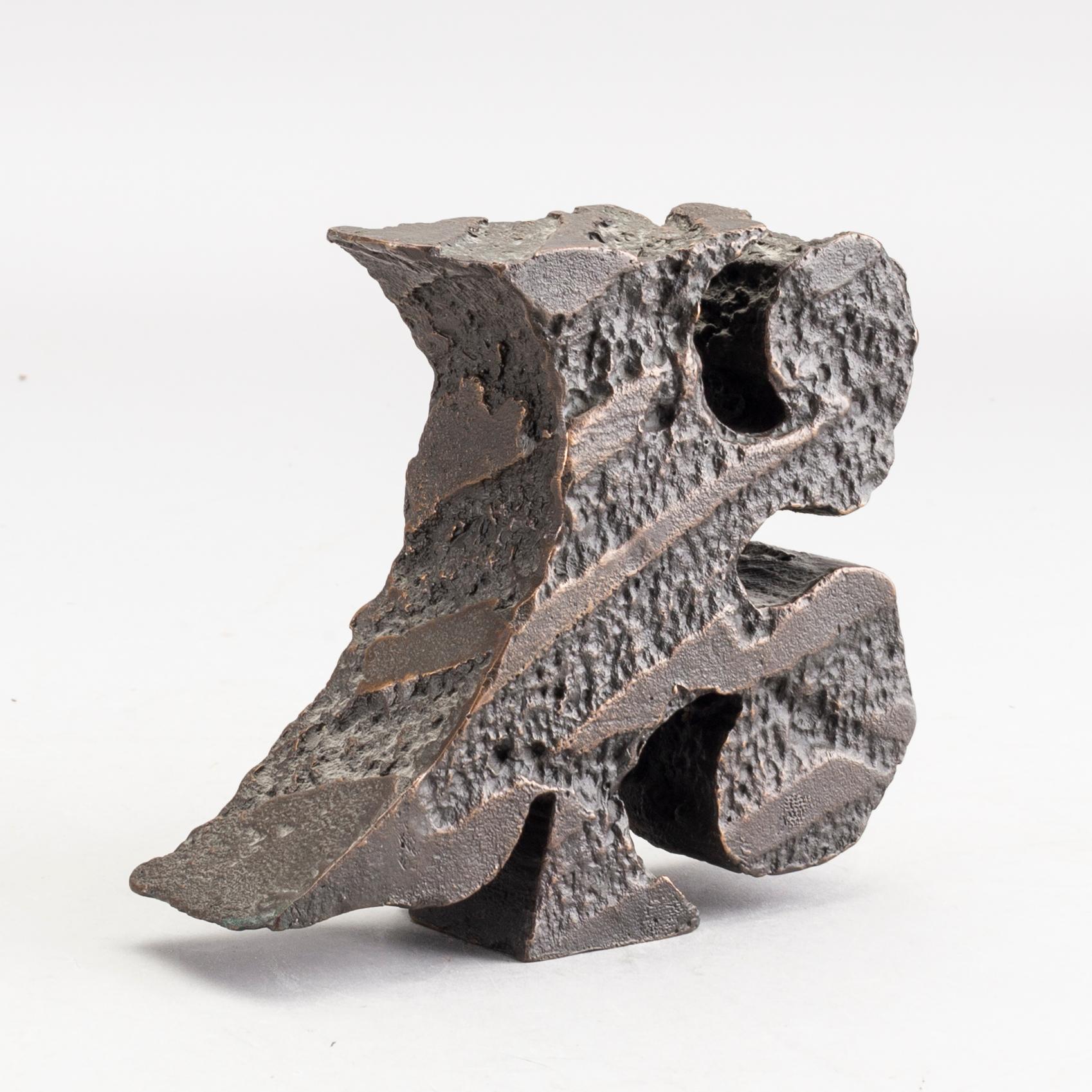 An signed and numbered bronze sculpture '23' by Carl Fredrik Reuterswärd.