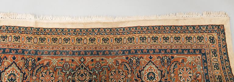 An oriental carpet. Circa 345x245 cm.